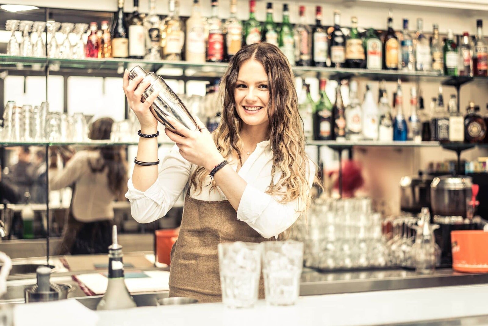 Female bartender shaking
