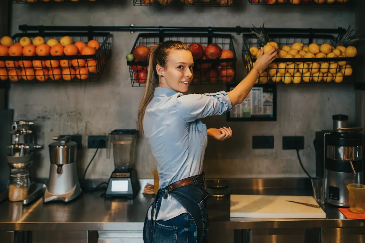 High Quality Juice Cleanse Corporate Packages London Professional chef selecting fresh fruits for juice cleanse corporate packages in commercial kitchen - Pearl Lemon Catering