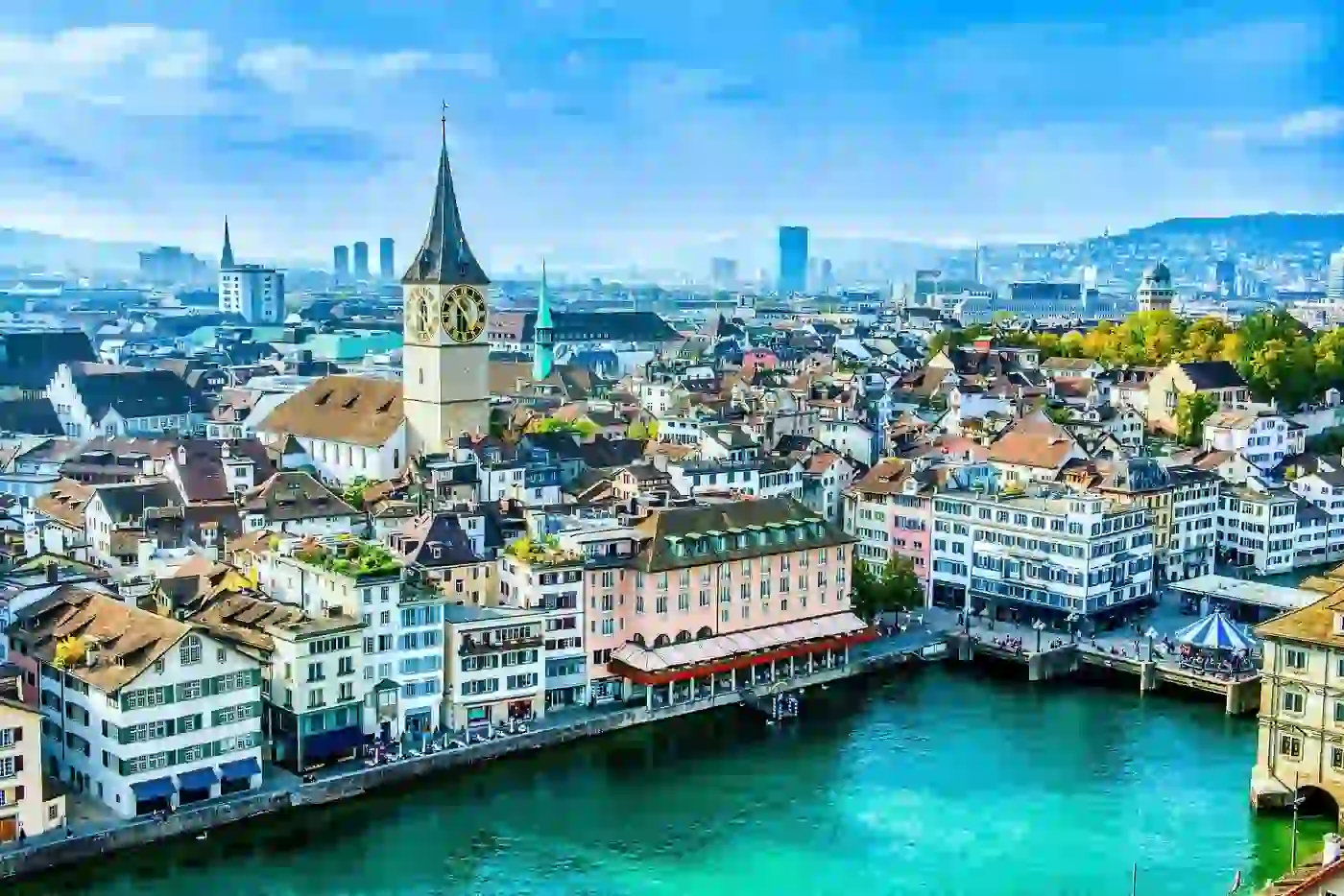 Premium corporate catering services in Zurich, Switzerland featuring scenic cityscape with traditional architecture and crystal-clear river views