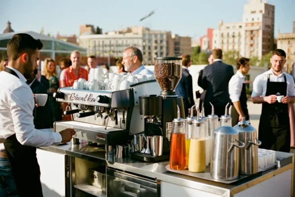 Barista serving coffee at outdoor corporate event in Barcelona with mobile coffee setup