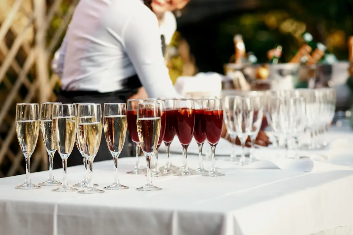 Italian cocktail party catering setup with elegant canapés, antipasti bites, and gourmet finger foods arranged on stylish serving trays.