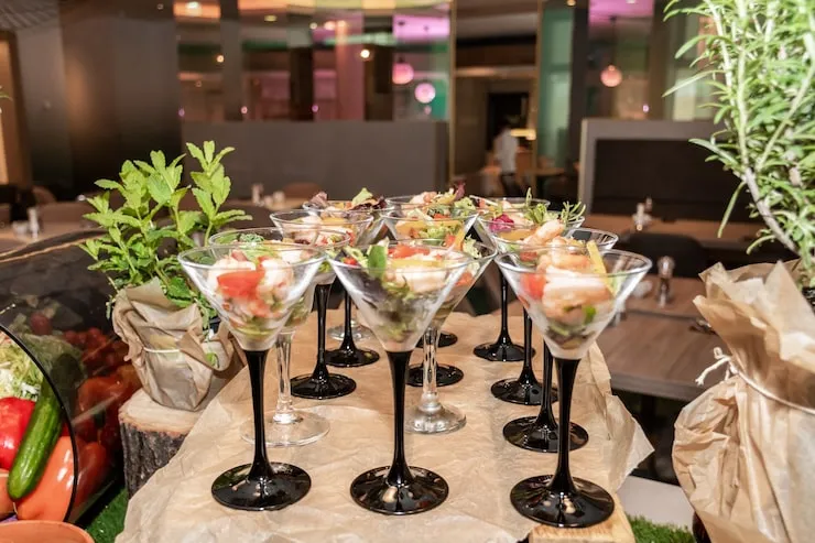 Elegant cocktails garnished with fresh herbs.