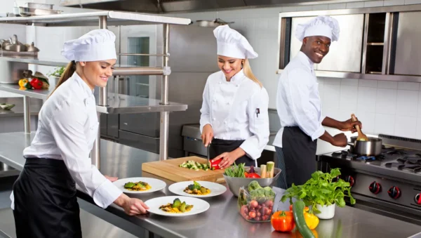Professional catering team preparing high-quality dishes for corporate events in Berlin.