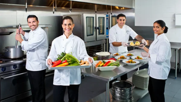 Professional catering team showcasing fresh ingredients and quality service, representing why clients choose our corporate catering services in Copenhagen, Denmark.