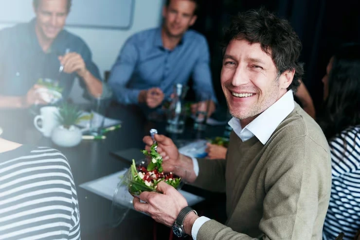 Corporate team enjoying a festive breakfast supported by structured Christmas breakfast menu packages