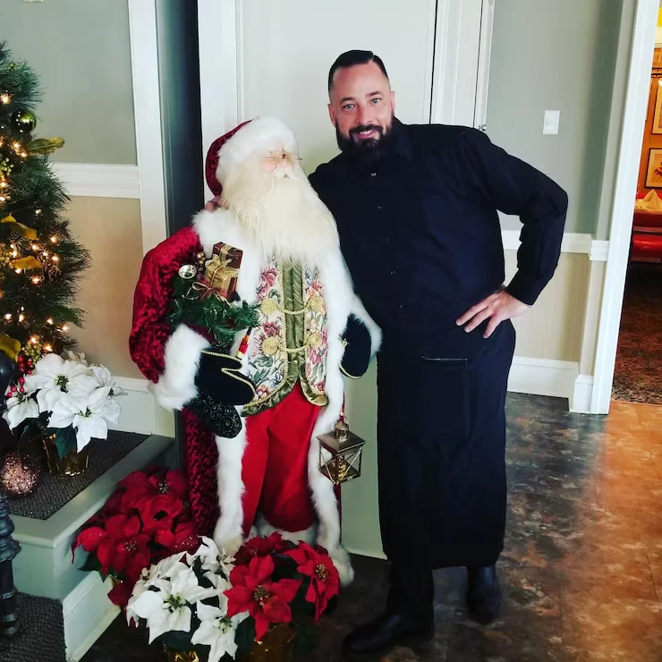 Expert full-service staffed Christmas catering team preparing warm festive dishes for large gatherings