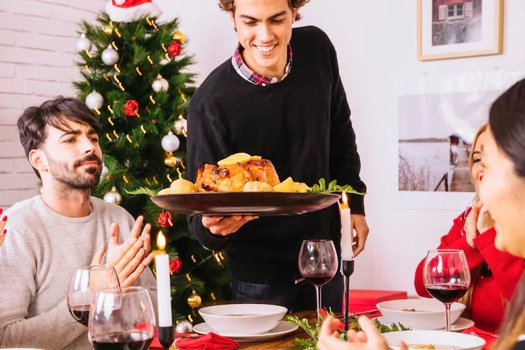 Hot buffet dishes being served during a Christmas lunch supported by professional hot buffet Christmas lunch catering