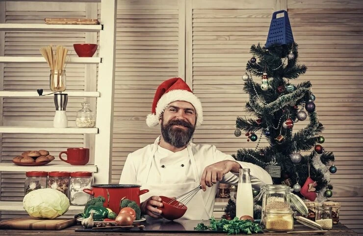 Private chef preparing festive dishes for a corporate Christmas party