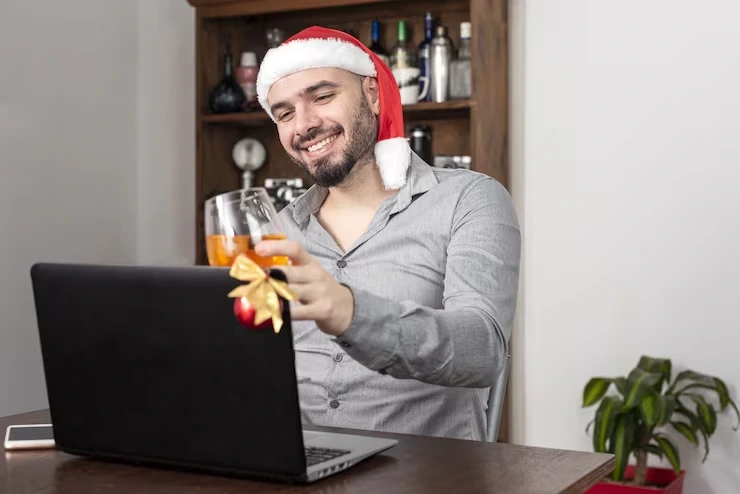 Remote employee celebrating Christmas with food packages arranged for workplace teams
