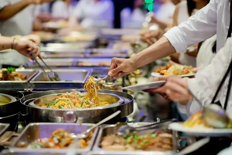 High volume catering service efficiently serving food and drinks to large numbers of exhibition attendees
