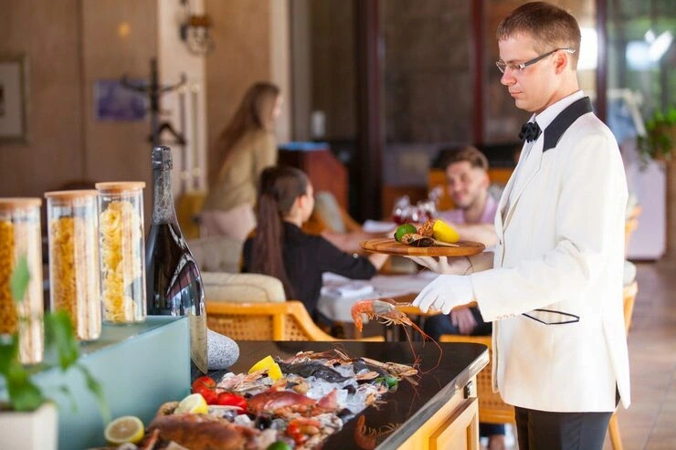 On-site catering service management and oversight with staff coordinating food service at a VIP sports event