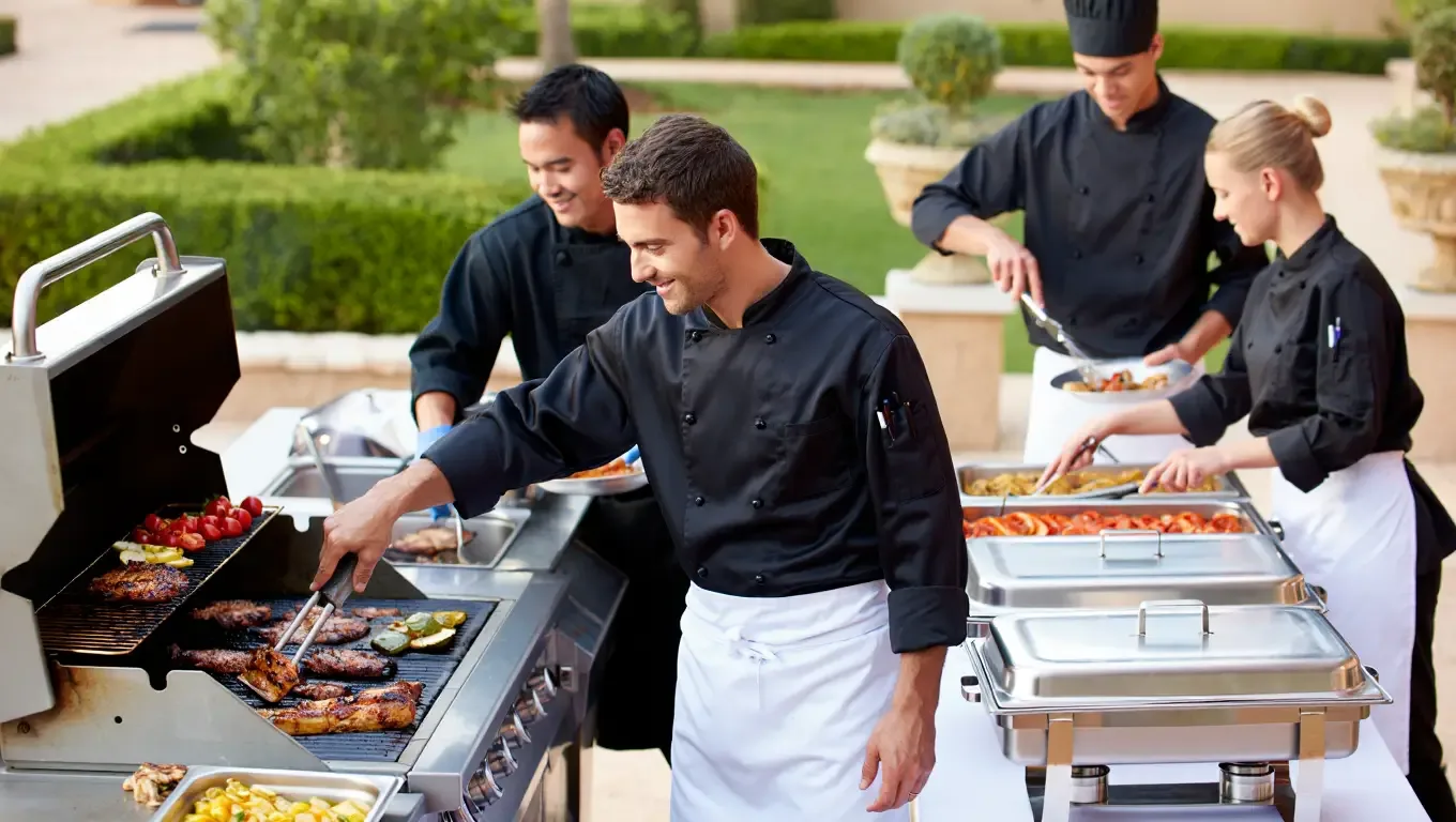 Pearl Lemon BBQ catering services with expertly grilled food and professional presentation at an outdoor event