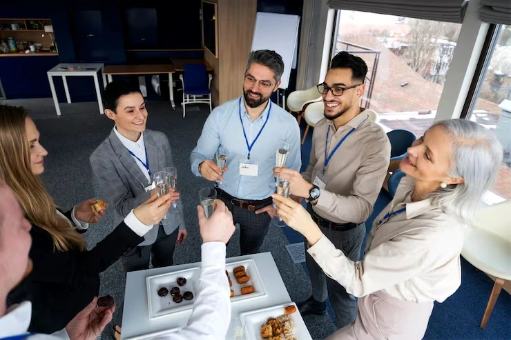 Professionals toasting drinks at corporate event