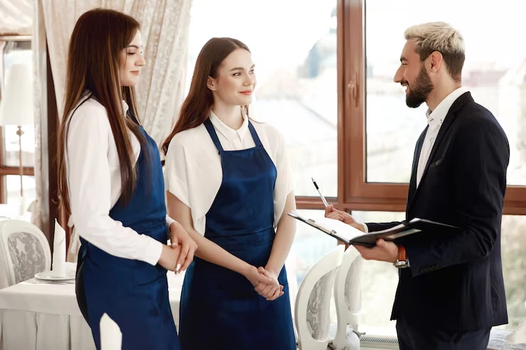 Hospitality staff coordinating a catered London event venue