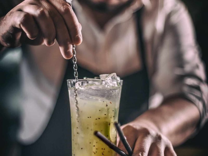 Bartender is stirring cocktail