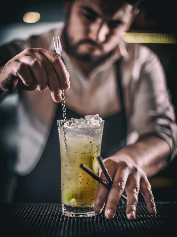 Bartender is stirring cocktail