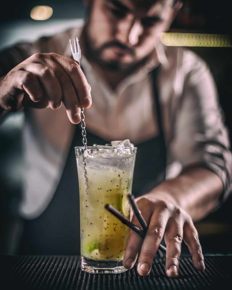 Bartender is stirring cocktail