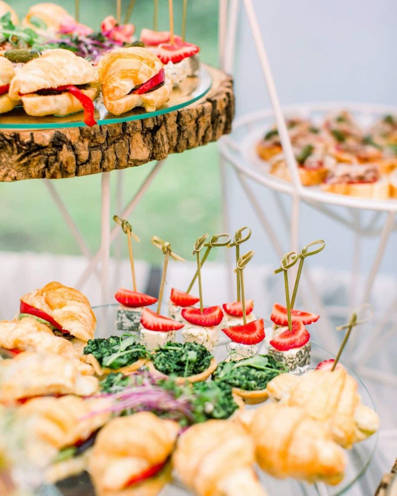 Beautifully decorated catering banquet table with different food snacks and appetizers on corporate, Party Catering London, outside event catering London