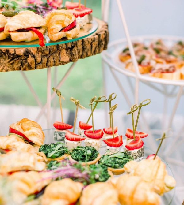Decorated wedding table with snacks and appetisers at an outdoor corporate catering event in London