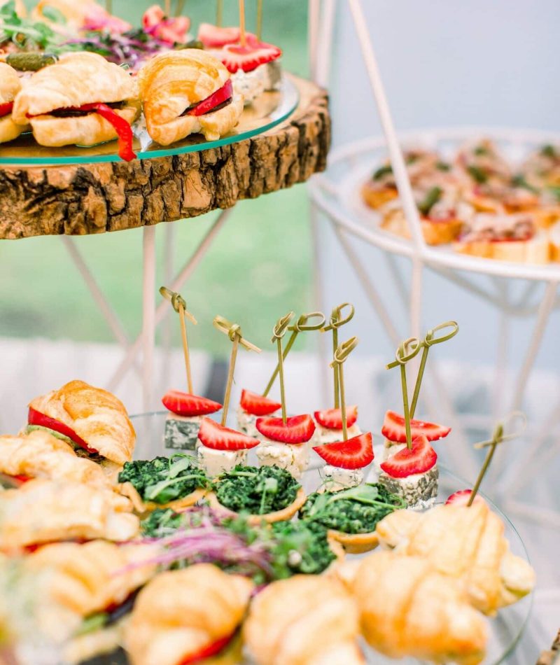 Decorated wedding table with snacks and appetisers at an outdoor corporate catering event in London