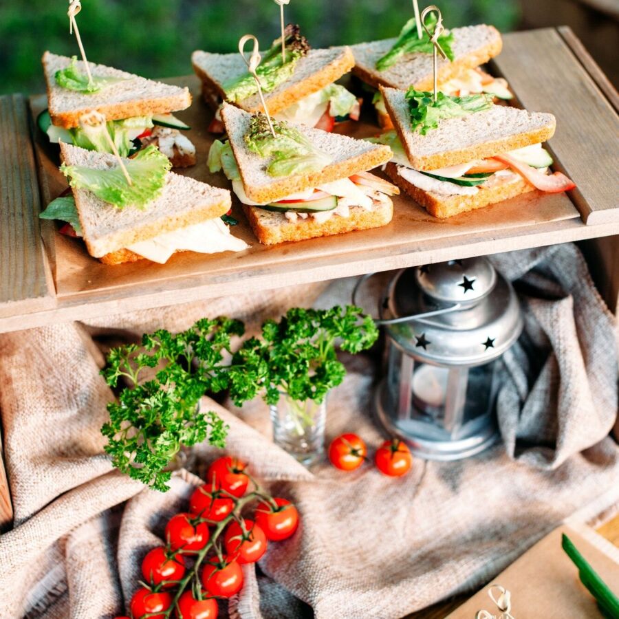 catering banquet buffet table with sandwiches and snacks