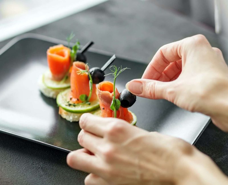 Delicious appetizers with red fish and lime. Concept of food, restaurant, catering, menu.