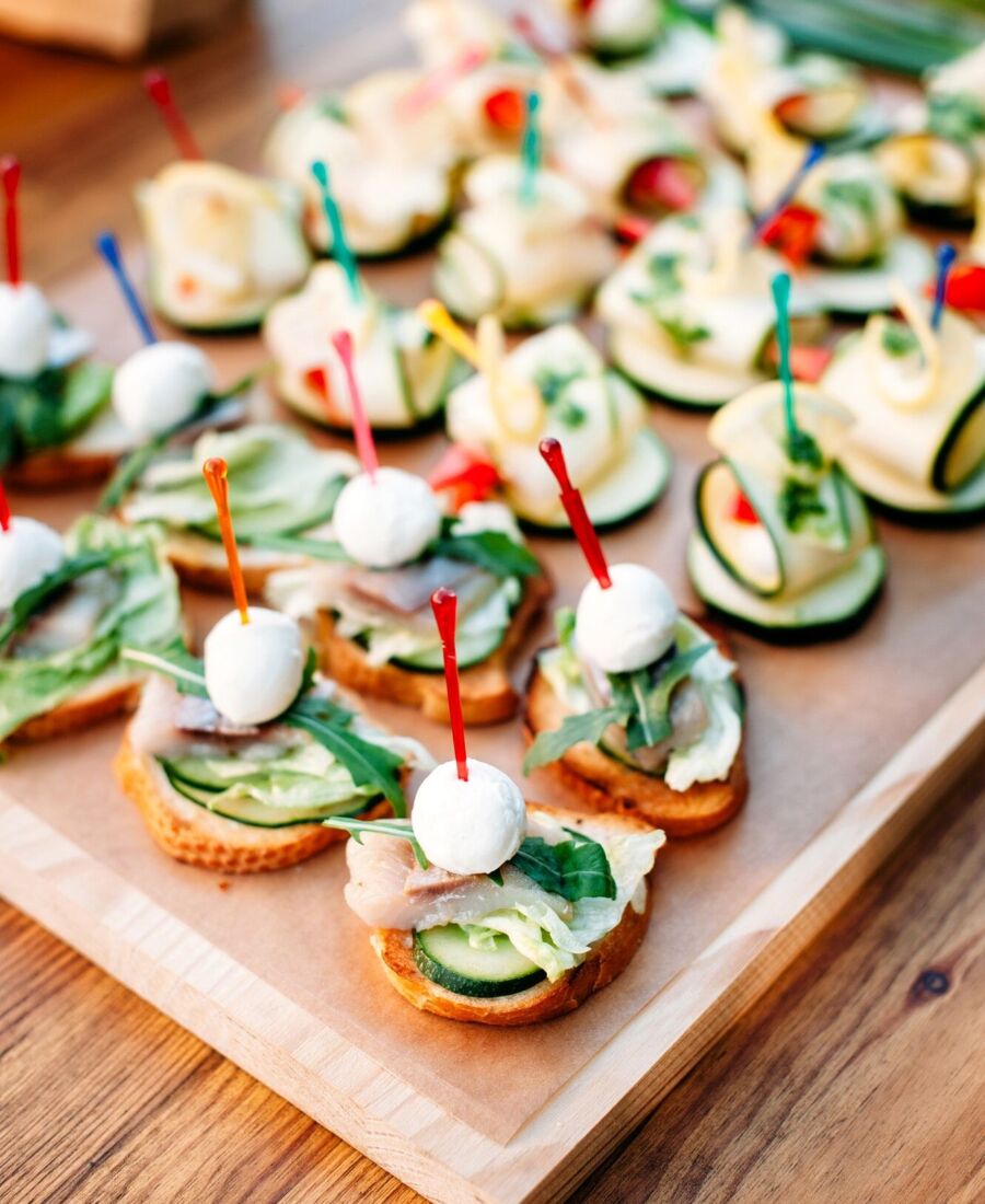 delicious catering finger food set with smoked fish and cheese. Catering banquet table