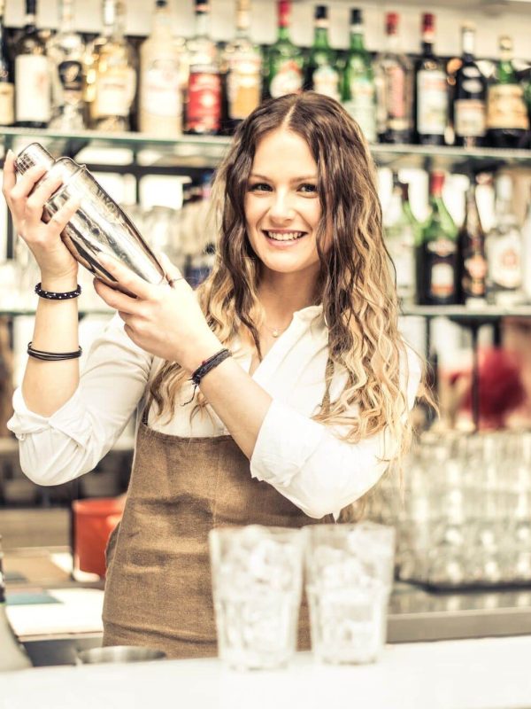 Female bartender shaking